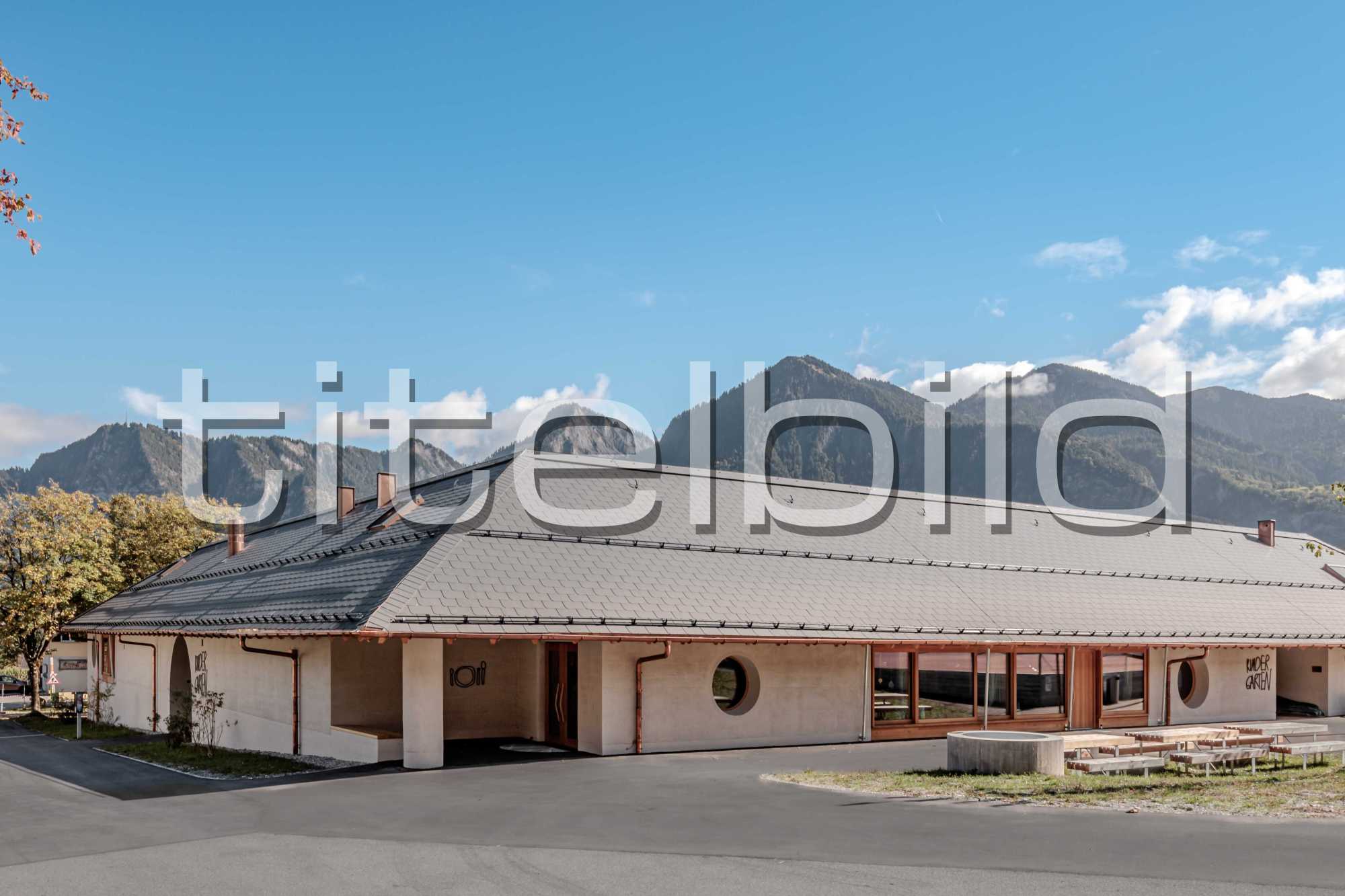 Projektbild-Nr. 0: Neubau Kindergarten mit Einstellhalle und Sportplatz